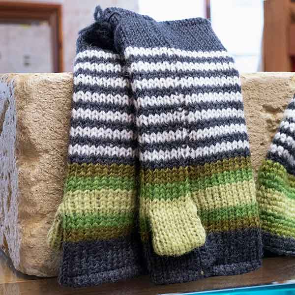 green and white stripy knitted mittens