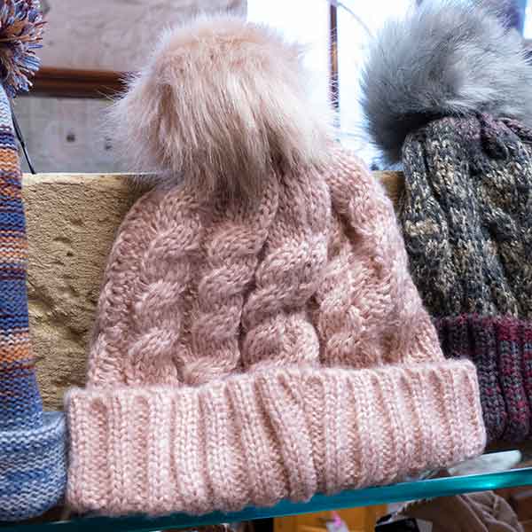 pale pink cable knit fluffy pom pom bobble hat