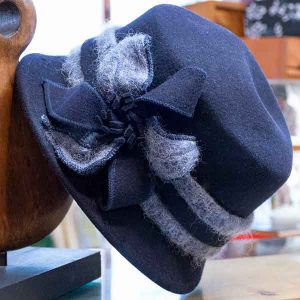 blue felt cloche hat with grey fluffy band and bow