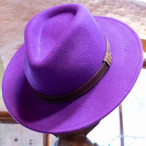 mauve fabric trilby hat with brown leather band