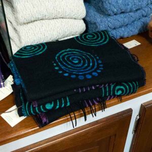 Blue and green spirals on black fringed scarf, £24.99