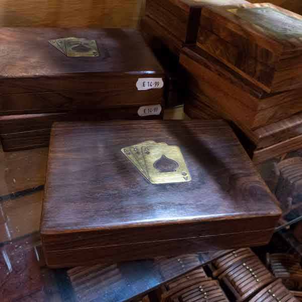 Dark wood games boxes with inlaid brass card deck motif, £14.00