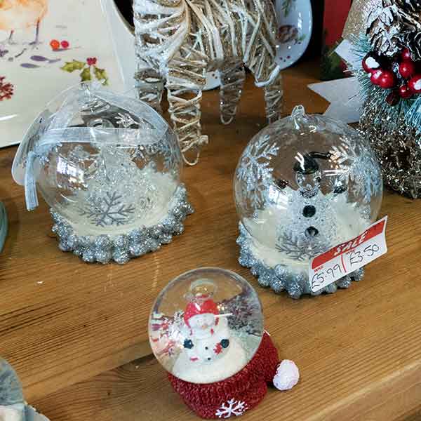 Glass snowman and angel Christmas decoration in silver and white, from £5.99 to £3.50
