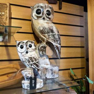 Rustic carved owls in light wood on perch stand, large £47.50, small £22.50