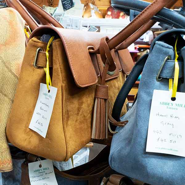 Suede tassel handbags in grey and brown £42.50